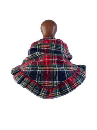 Plaid fabric on a mannequin head with a white background