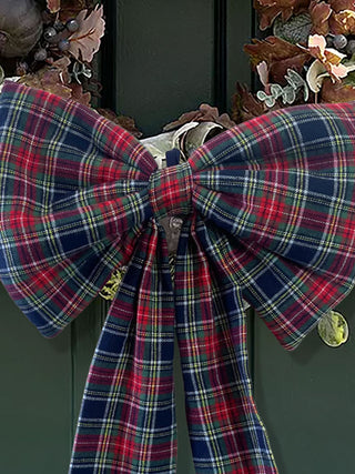 tartan bow on wreath on wooden door