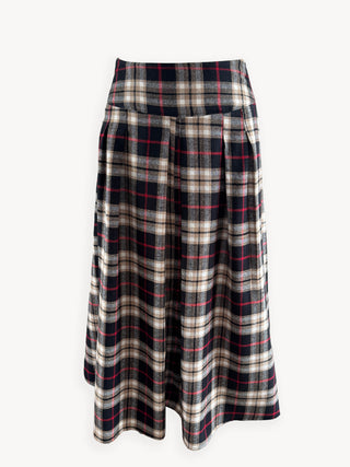 Plaid skirt with black, white, and red pattern on a white background