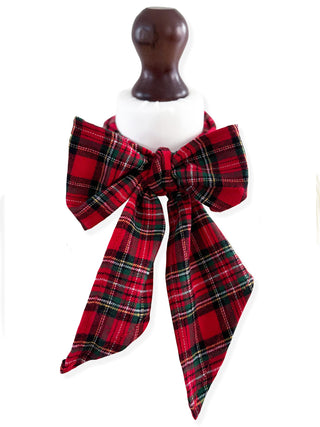 Red plaid bow on a mannequin with a white background