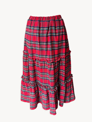Red plaid skirt with ruffled layers on a white background