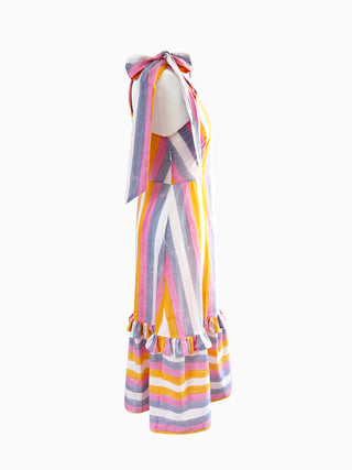 Side angle of The Mila Dress showing tie-shoulder bow detail – sustainable UK fashion crafted from leftover cotton for warm-weather wear.