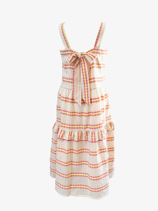 Striped dress with a bow detail on a white background