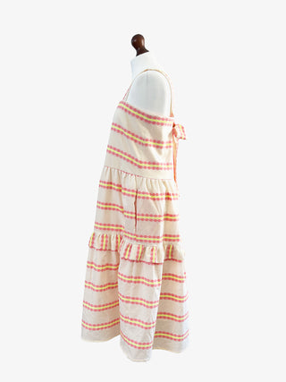 Striped dress on a mannequin against a white background
