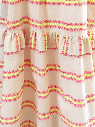 off white dress with coral and yellow geometric pattern