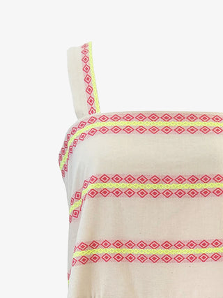 off white dress with pink and yellow geometric patterns on a white background