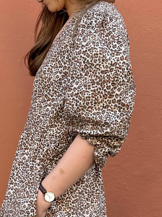 Detail of gathered sleeve and leopard print pattern on sustainable cotton fabric.