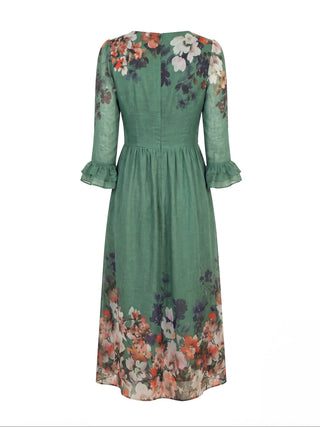 Green dress with floral patterns on a white background