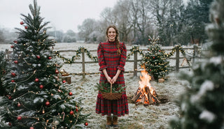woman wearing red tartan dress in festive setting 