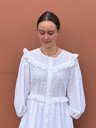 Sustainable white embroidered maxi dress styled with espadrilles, from The Well Worn’s made-to-order collection