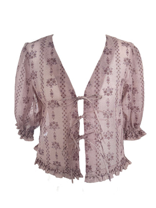 Sheer floral patterned top on a white background