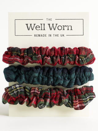 Set of plaid scrunchies on a card with 'The Well Worn' branding.