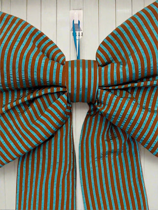 blue stripe bow on door