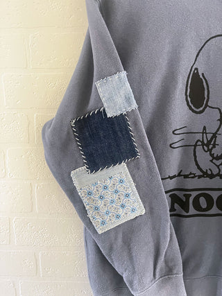 upcycled snoopy sweatshirt patch detail