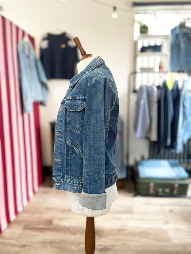 The Well Worn mended denim jacket on mannequin side