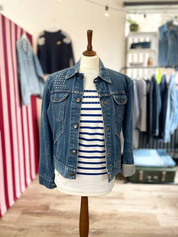 The Well Worn mended denim jacket on mannequin