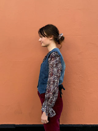 women wearing denim waistcoat side view