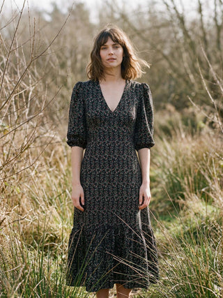 model wearing black floral dress