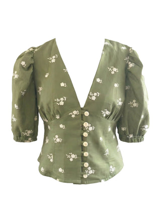 Green floral blouse on a white background