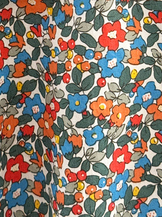 Colourful floral pattern on a deadstock cotton fabric background