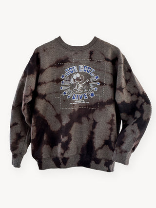 Tie-dye sweatshirt with a snoopy graphic design on a white background