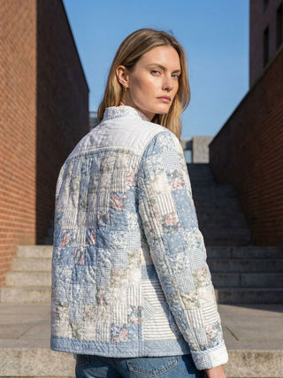 model wearing vintage blue quilt jacket