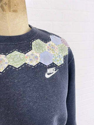 upcycled sweatshirt detail on mannequin