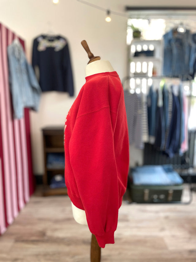 The Well Worn red graphic sweatshirt on mannequin side