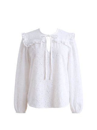 White blouse with lace details on a white background