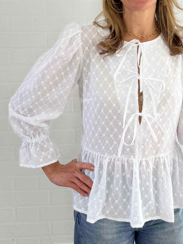 The Well Worn women wearing white broderie top detail