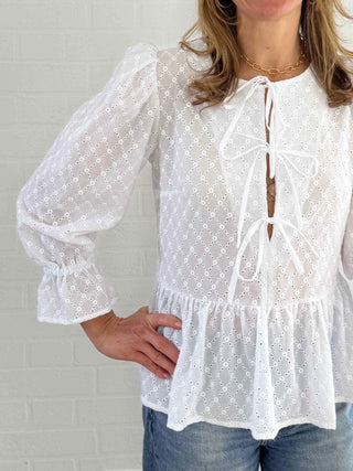 women wearing white broderie top detail