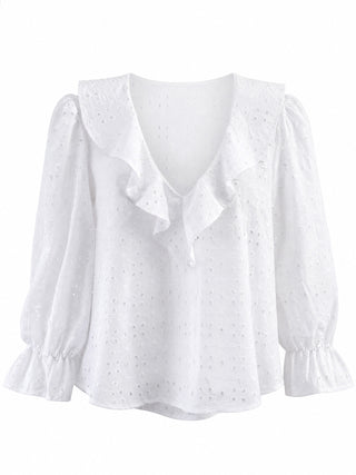 White eyelet blouse with a ruffled collar, ruffled front placket, and long puff sleeves with ruffled cuffs, shown on a plain white background.
