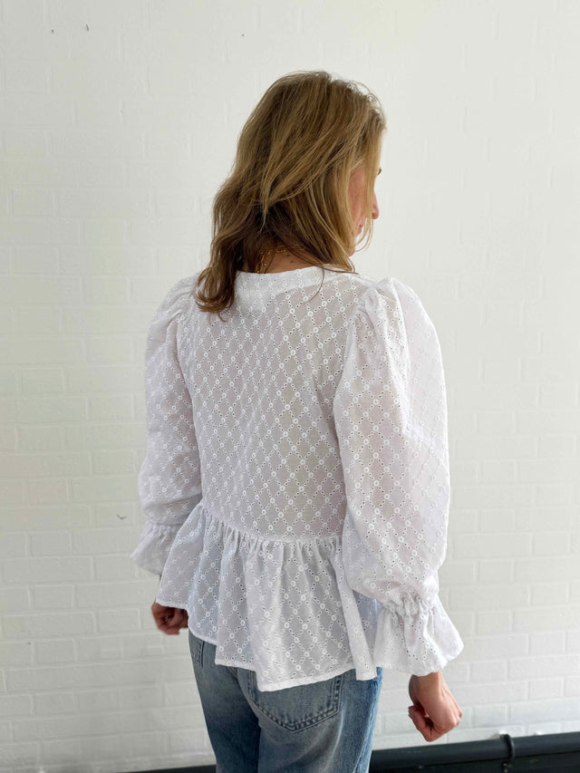 The Well Worn women wearing white broderie top back detail