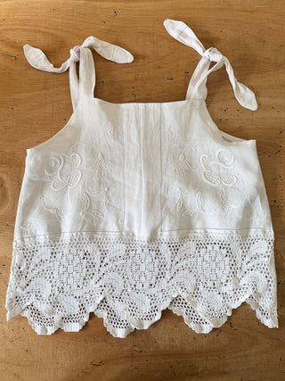 White lace top on a wooden surface