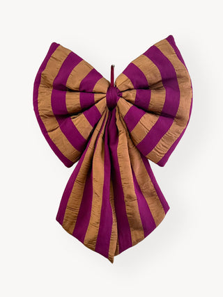 burgunday-bronze-bow-on-white-wall