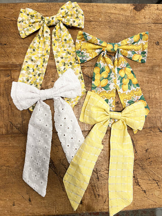 collection of sustainable hair bows on table