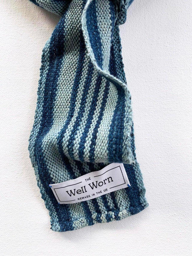 The Well Worn narrow-indigo-scarf-on-table-label