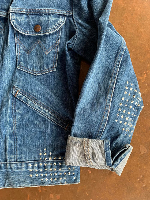 The Well Worn cuff-detail-stitched-denim-jacket-on-table