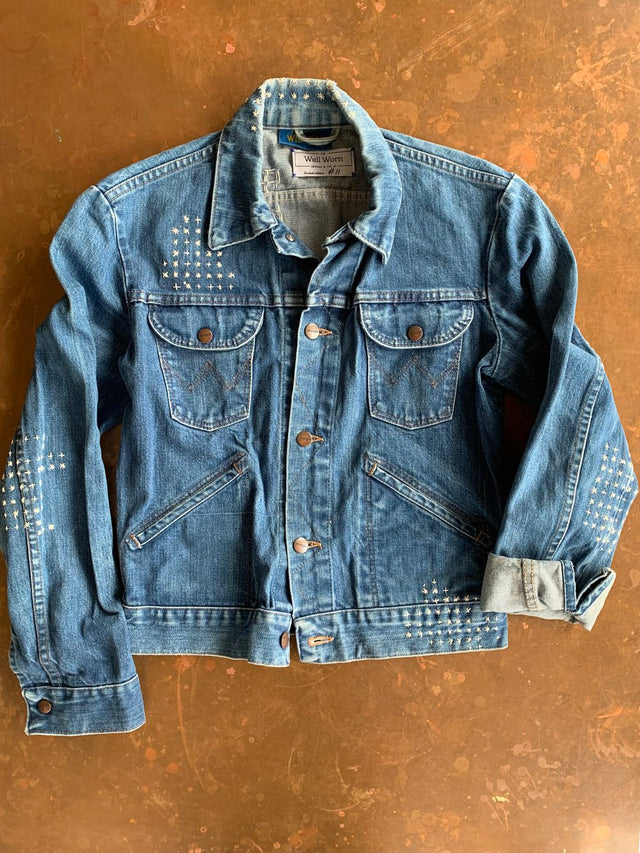 The Well Worn stitched-denim-jacket-on-table