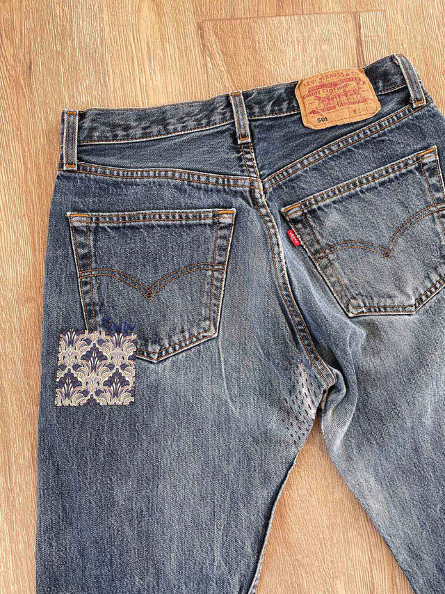 patched-jeans-on-floor-back-detail